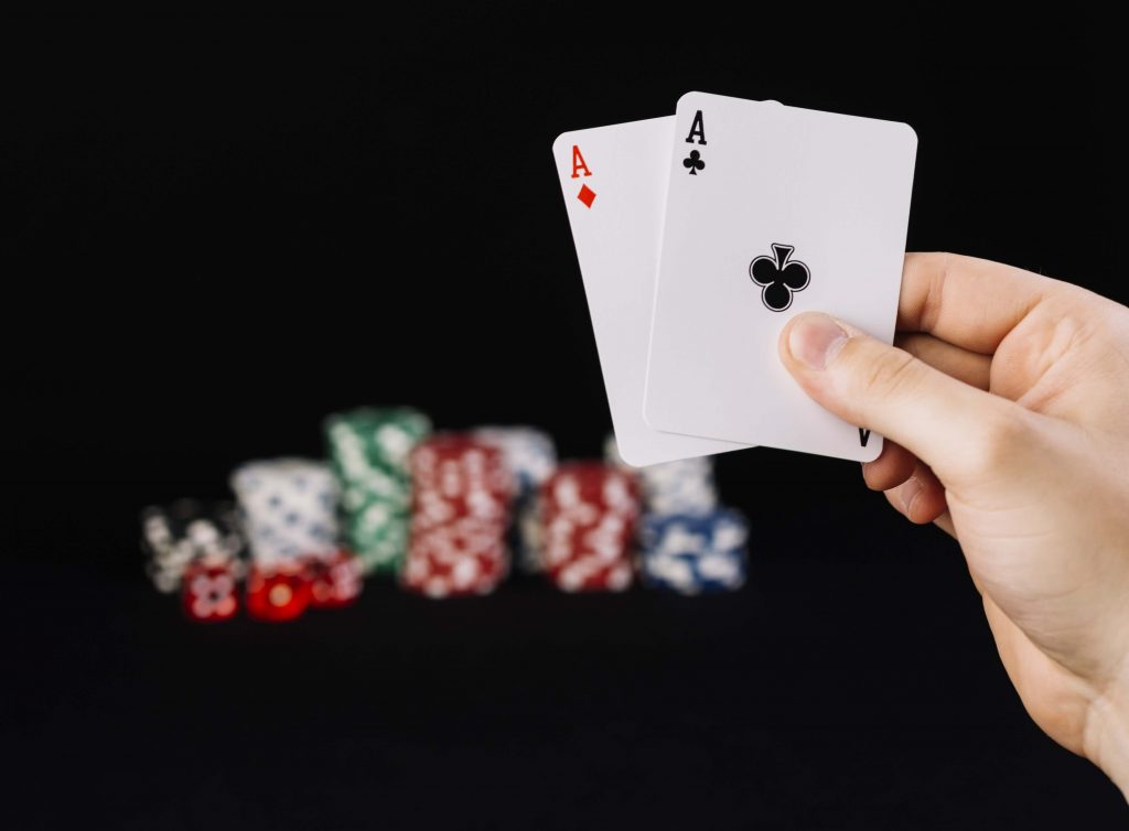 man_holding_cards